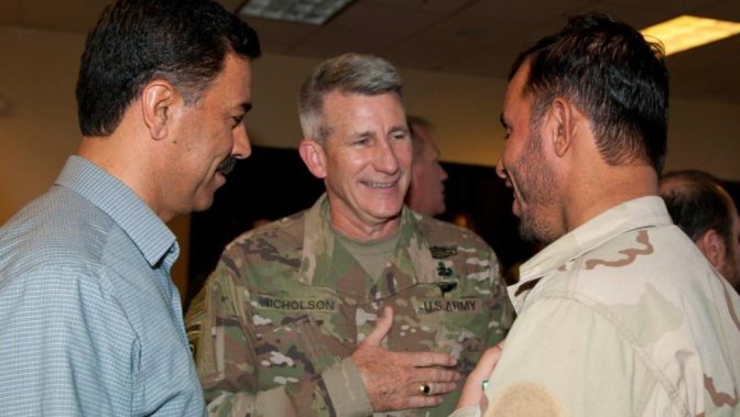 A photo depicting General John Nicholson, Commander of United States forces in Afghanistan (C) with Kandahar's General Abdul Raziq (R).